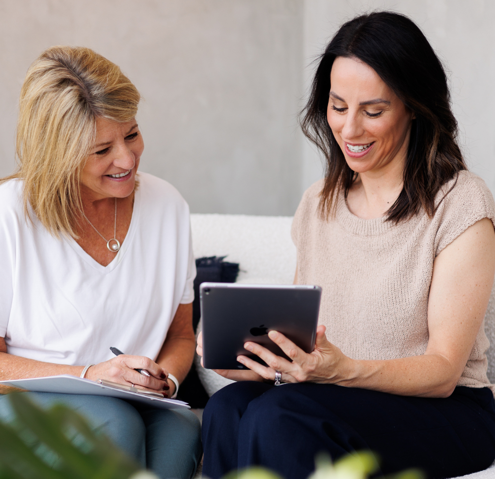 An Instincts skin therapist reviewing a personalised skin plan with a client in the Bella Vista clinic